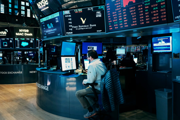 A trader works at a computer on the floor of the New York Stock Exchange