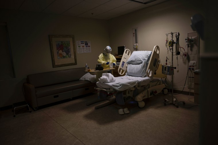 A nurse prepares to release a mother who had given birth earlier that day after testing positive for Covid-19 in a Covid section of the maternity ward at Women's Center of the Doctors Hospital at Renaissance in Edinburg, Texas, on July 8, 2020.
