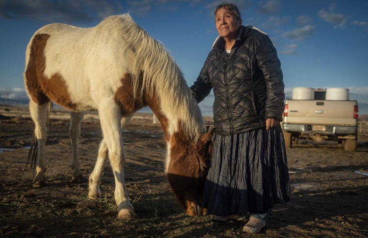 Help-Hood with her horse in Tohlakai, N.M. 