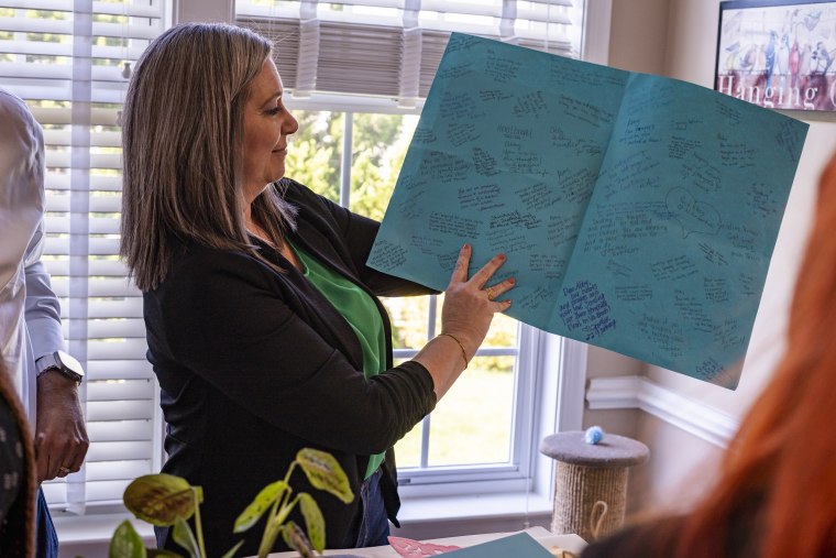 Abigail Zwerner’s mother Julie, looks through some letters and gifts sent to her daughter by people across the country at an undisclosed location in Virginia on March 20, 2023. 