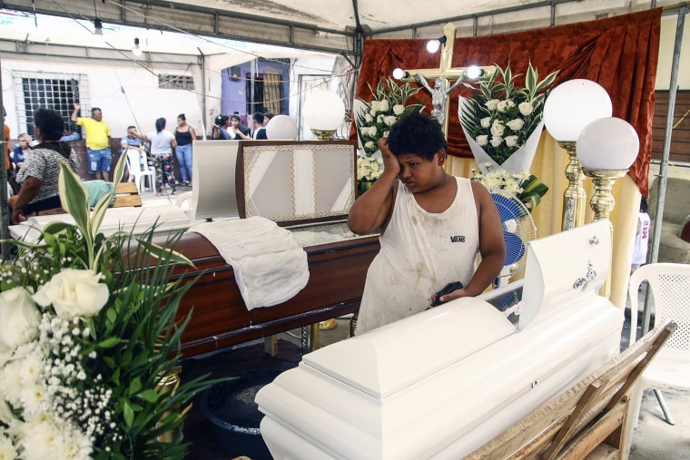 Image: A person attends the funeral of the victims of an earthquake, in Puerto Bolívar, Ecuador, on March 19, 2023.