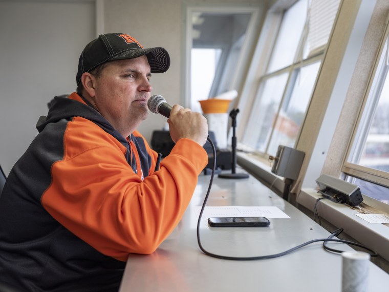 Robert Lee ISD Superintendent Aaron Hood announces during a middle school track meet from the PA box in Robert Lee, Texas on March 9, 2023.