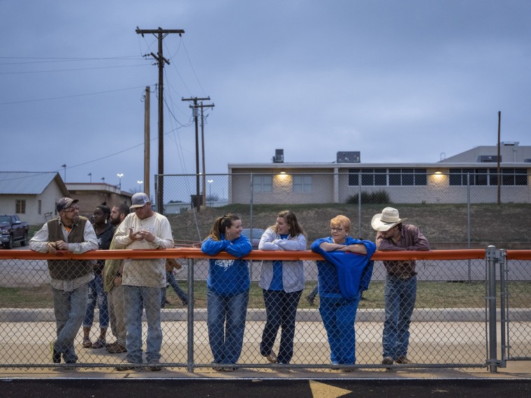Spectators watch a track and field event during a middle school track meet at Robert Lee ISD in Robert Lee, Texas on March 9, 2023.