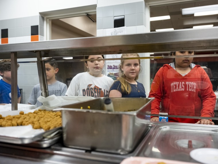 Students line up to receive their lunch at Robert Lee ISD in Robert Lee, Texas on March 9, 2023.