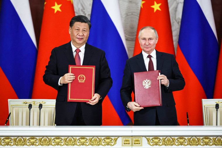 Russian President Vladimir Putin and Chinese President Xi Jinping attend a signing ceremony following their talks at the Kremlin in Moscow on March 21, 2023.