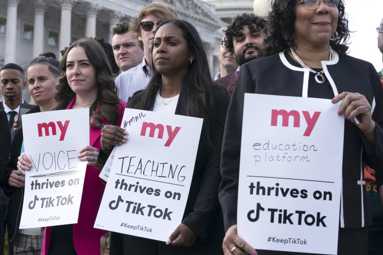 Supporters of TikTok hold signs during a rally to defend the app at the Capitol in Washington, Wednesday, March 22, 2023. The House holds a hearing Thursday, with TikTok CEO Shou Zi Chew about the platform's consumer privacy and data security practices and impact on kids.