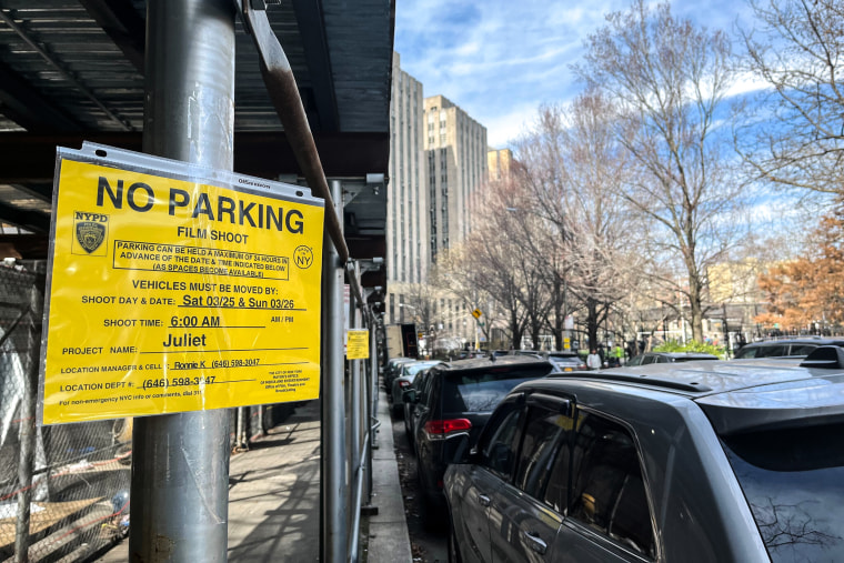 A sign limiting parking for a movie shoot near the New York courthouse.