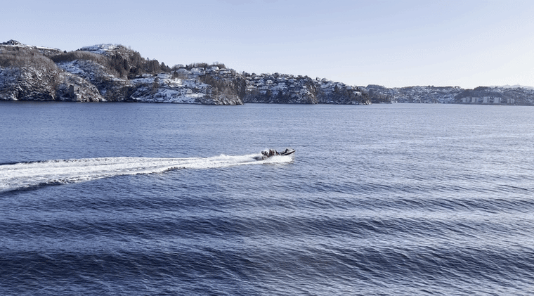 A fast boat from the Norwegian Coast Guard ship, the KV Sortland, patrols the undersea pipelines in the North Sea.