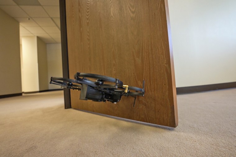 A drone designed to be used by SWAT teams opens a door during a demonstration for NBC News.