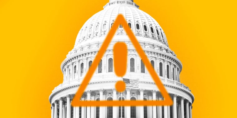 Photo Illustration: The Capitol building with an orange warning sign emblazoned on it