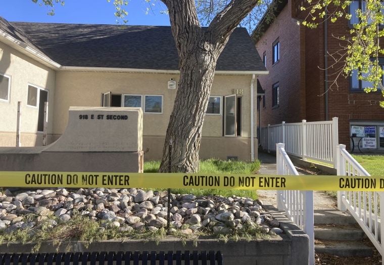 The fire-damaged Wellspring Health Access clinic is cordoned by tape,in Casper, Wyo.