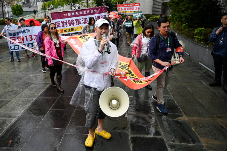 People hold the first authorised protest and march in several years in Hong Kong against the proposal for reclamation in the district on Tseung Kwan O on March 26, 2023.
