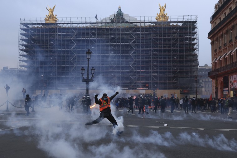 French unions are holding their first mass demonstrations Thursday since President Emmanuel Macron enflamed public anger by forcing a higher retirement age through parliament without a vote. (AP Photo/Aurelien Morissard)
