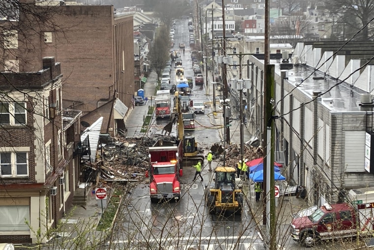 Emergency responders and heavy equipment are seen at the site of a deadly explosion at a chocolate factory in West Reading, Pennsylvania, Saturday, March 25.