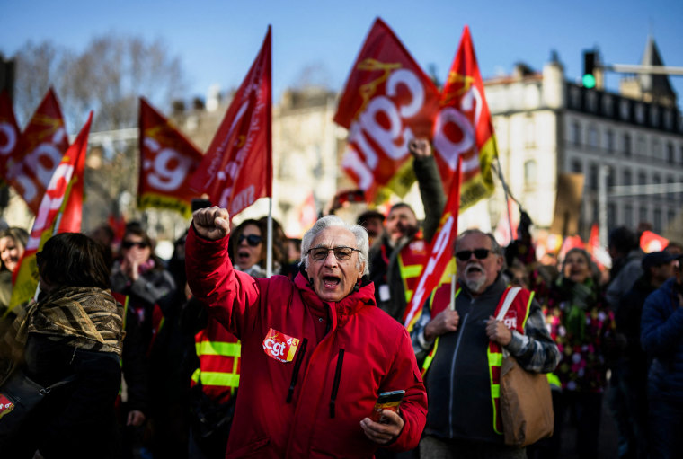 People protest after the government pushed a pensions reform through parliament without a vote in Clermont-Ferrand, France, on March 28, 2023.