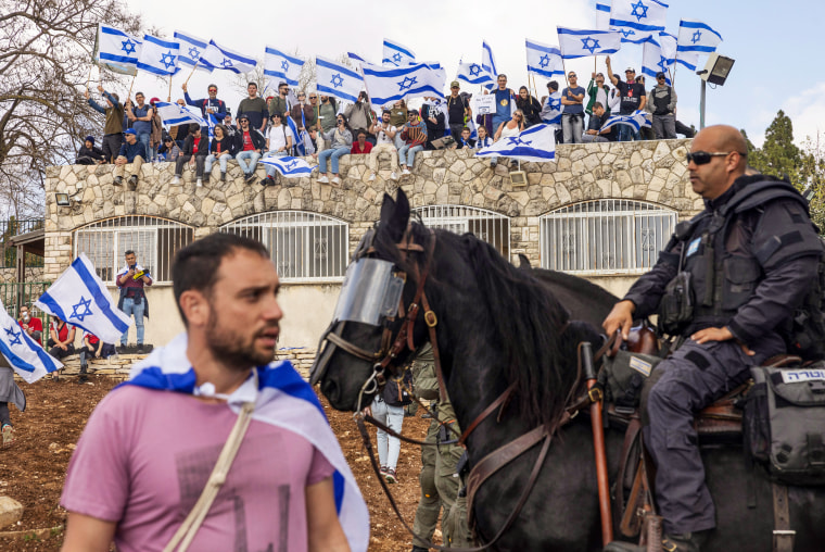 Netanyahu is considering a delay to his judicial overhaul after protests escalated, while the countrys main trade union joined a national strike which halted international flights. 