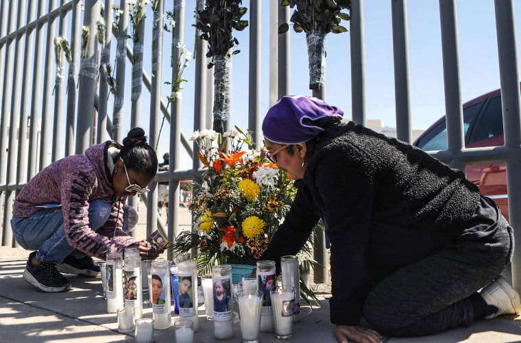 Image: Activists and migrants lay a floral offering on a makeshift altar during a protest outside an immigration detention center in Ciudad Juarez, Chihuahua state, Mexico, on March 28, 2023.