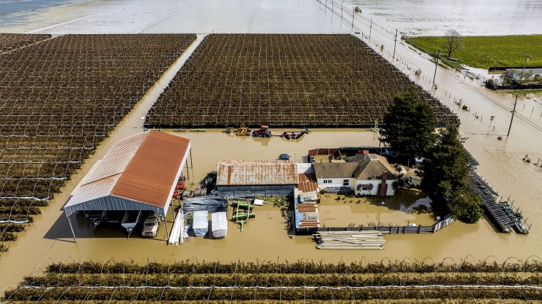 Floodwaters surround a home in Pajaro, Calif., on March 13, 2023.