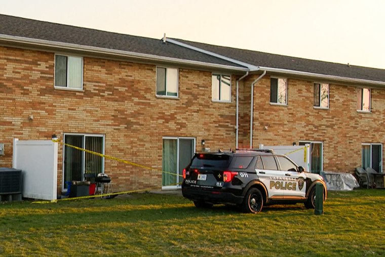 Police respond to a shooting at a home in Lafayette, Ind., on March 28, 2023.