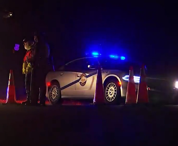 Officers guard the scene of a fatal Blackhawk helicopter crash in Trigg County, Ky., on March 29, 2023. 