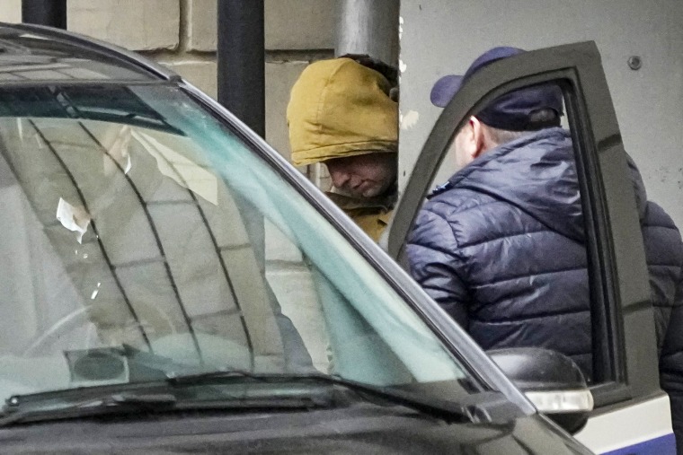 Image: Wall Street Journal reporter Evan Gershkovich is escorted by officers from the Lefortovsky court to a bus, in Moscow on March 30, 2023.