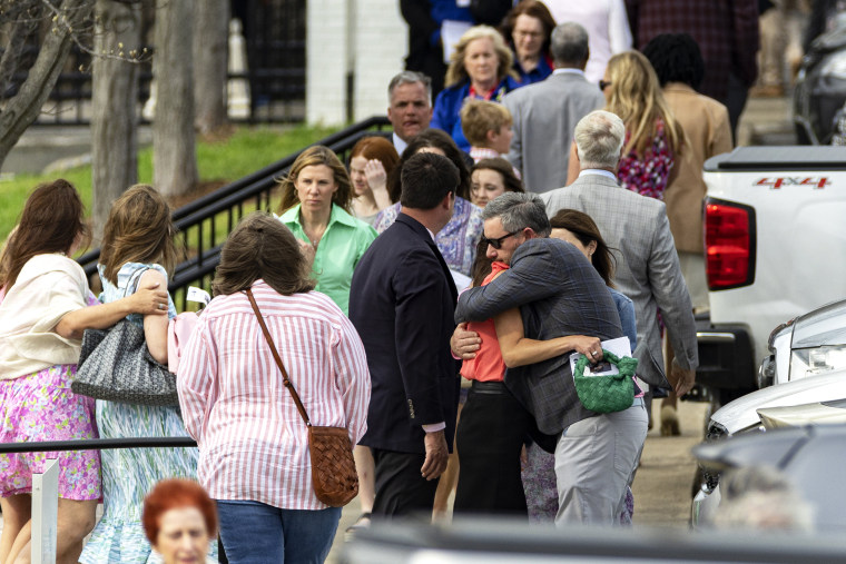Mourners embrace after a funeral service held for The Covenant School shooting victim Evelyn Dieckhaus at the Woodmont Christian Church Friday, March 31, 2023, in Nashville, Tenn.