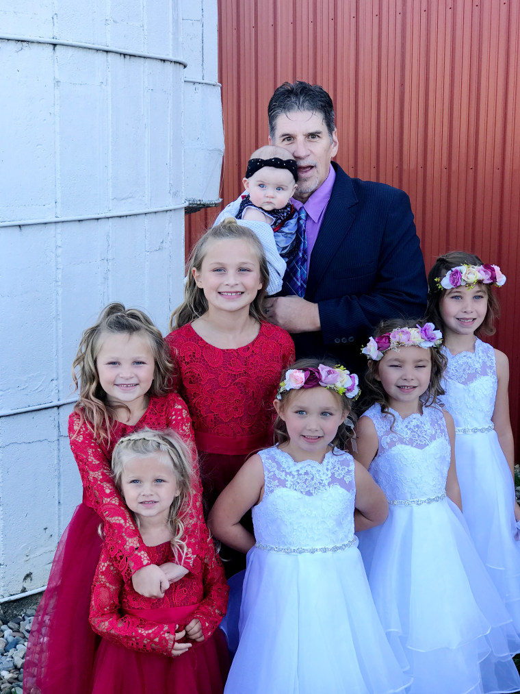 Greg Mascher with his granddaughters.