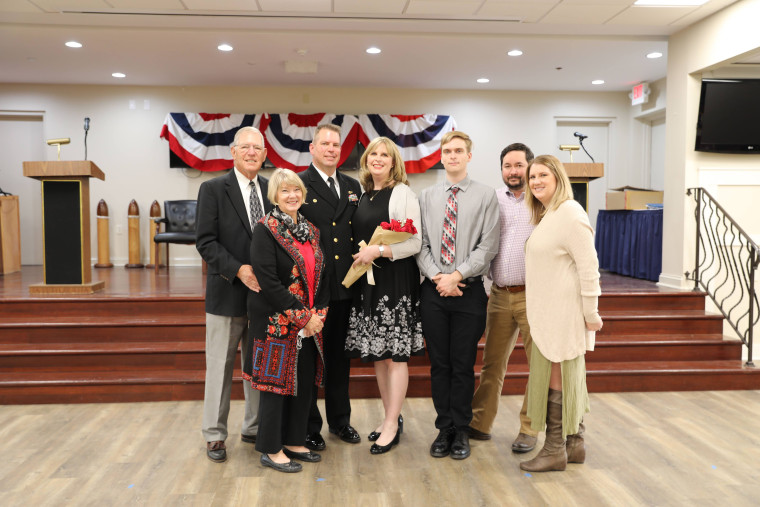 Heidi Evans with her husband and family at a recent promotion ceremony.