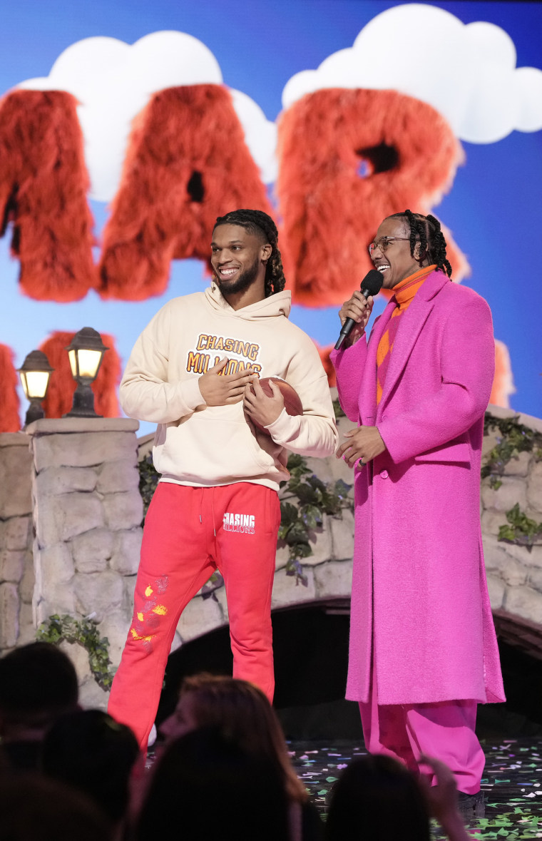 L-R: Damar Hamlin and host Nick Cannon in the “Sesame Street Night” episode of The Masked Singer. 