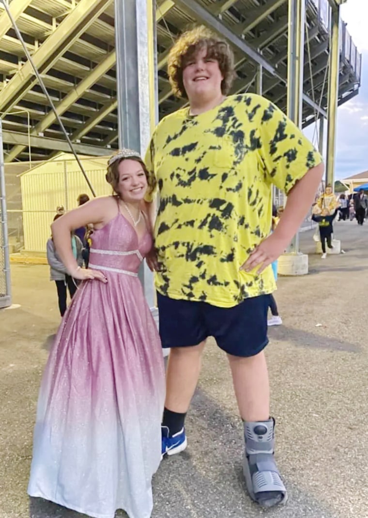 Eric Jr. posed with his friend Ashlynn at homecoming. He sprained his ankle playing football — an injury that likely could have been avoided if he had cleats. 