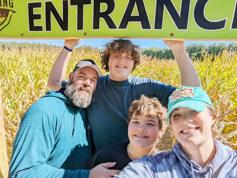 Eric Jr., pictured with his parents and brother, wears a size 23 shoe.