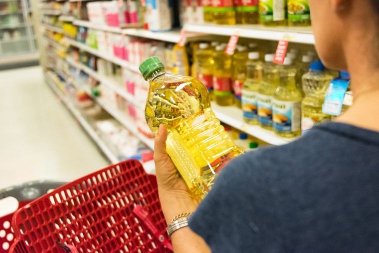 Shopping for cooking oil.