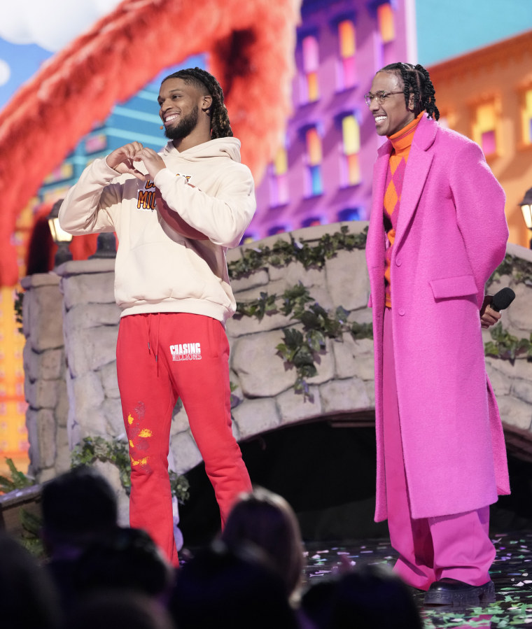 L-R: Damar Hamlin and host Nick Cannon in the “Sesame Street Night” episode of The Masked Singer. 