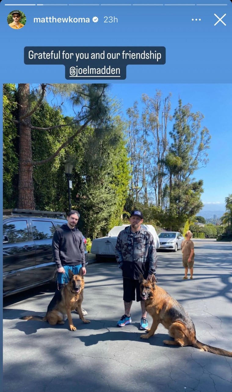 Joel and Matthew hanging out with some friendly dogs.