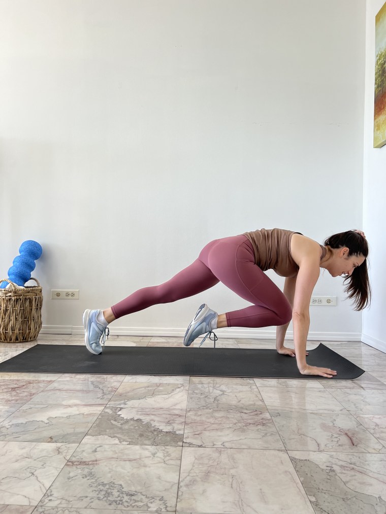 A woman doing a tabata workout 