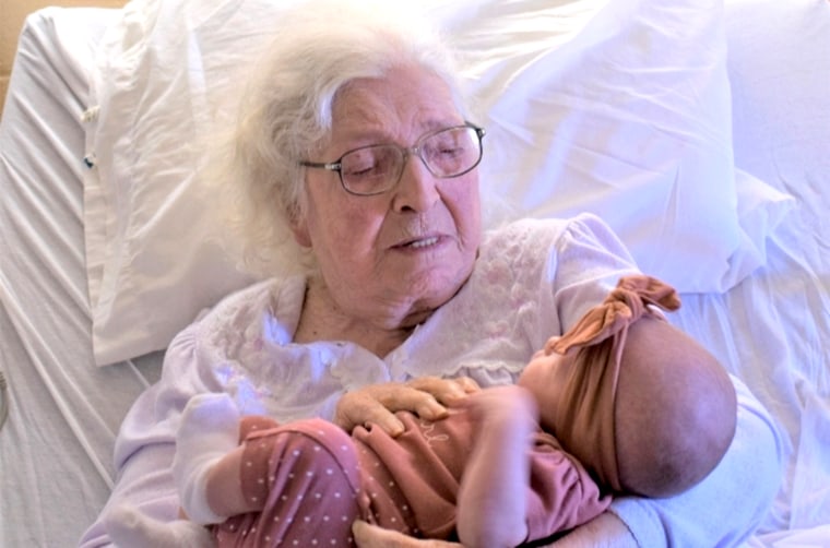 MaeDell, holding her great-great-great granddaughter.