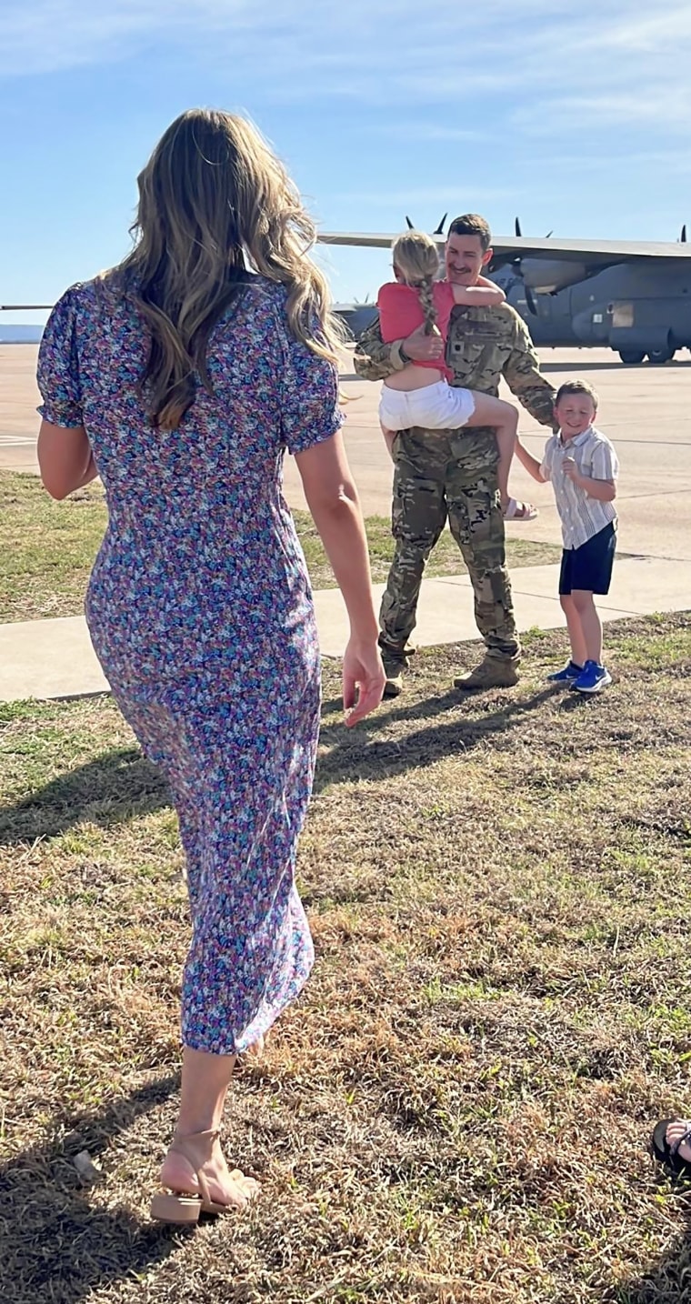 Lt. Col. Nate Clegg reunites with his family following a deployment. 
