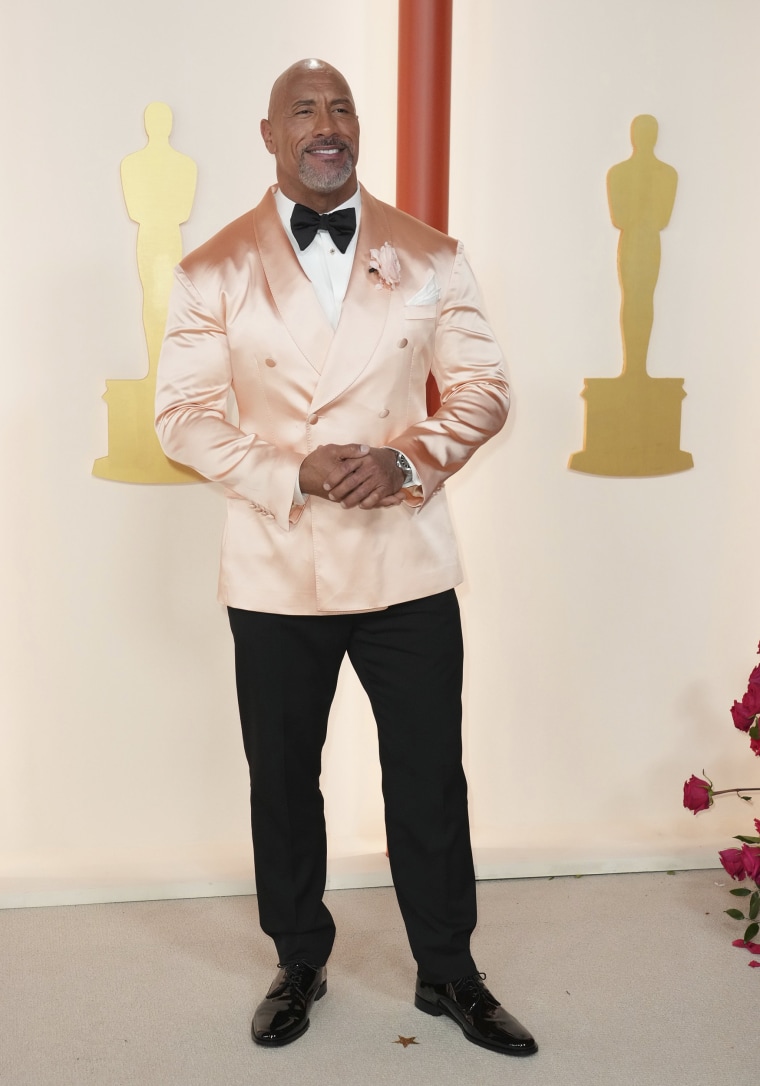 Dwayne Johnson arrives at the Oscars on March 12, 2023 in Los Angeles.