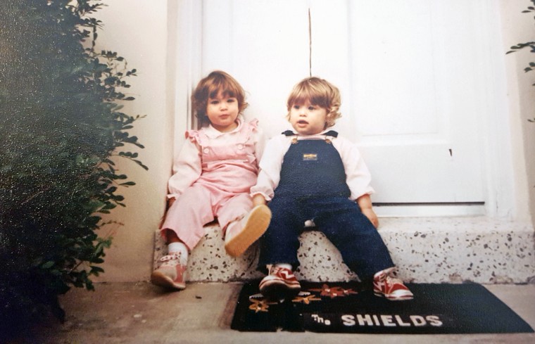 Sarah (in pink) and Jessica (in blue) as young girls.