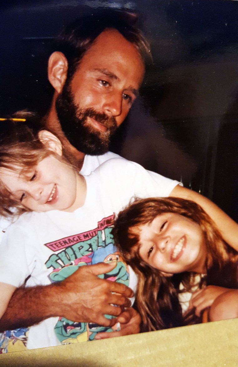 My husband holding  Jessica (in the Ninja Turtles shirt) and Alia when they were young.
