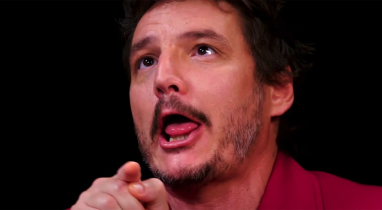 Pedro Pascal trying to quell the heat of the spicy wings.