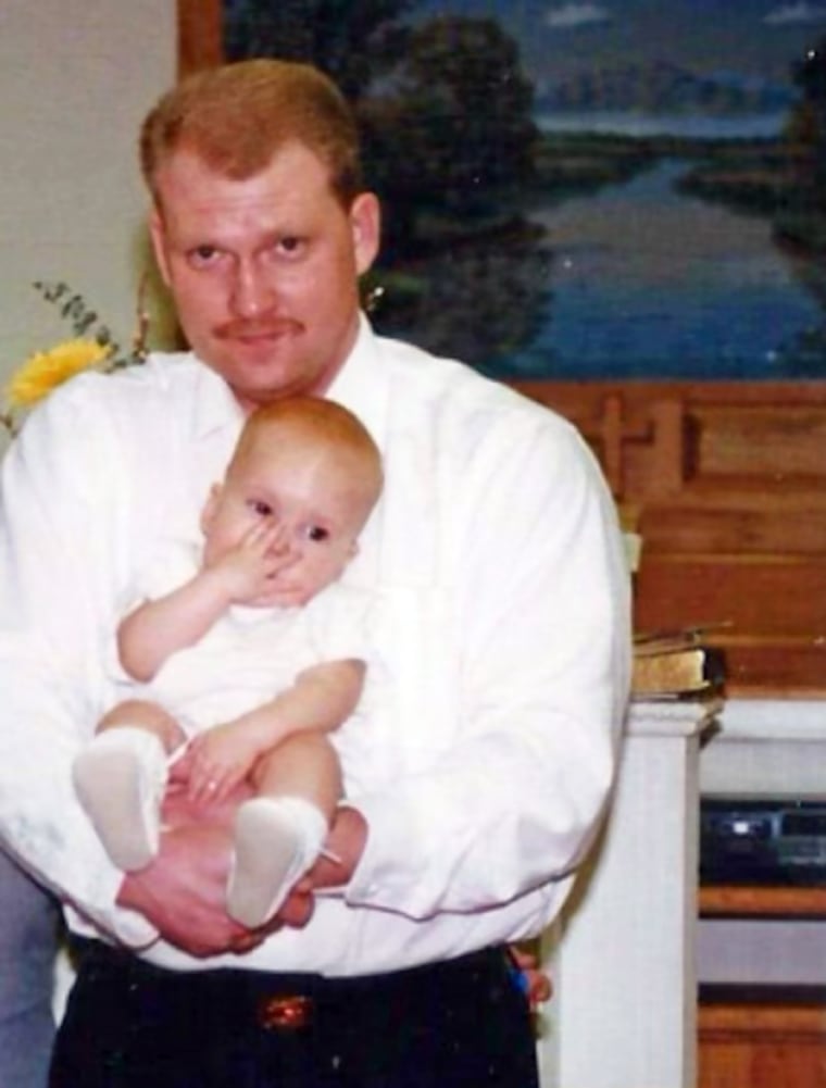 Tim Gore with his son, Caleb, as a child.