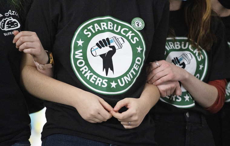 Starbucks employees and supporters react as votes are read during a union-election watch party Dec. 9, 2021, in Buffalo, New York.