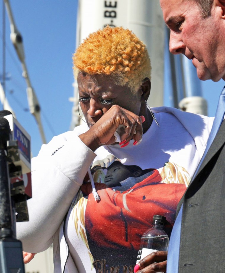 Nekia Dodd, mother of Tyre Sampson, wipes away tears while talking to the media at the site of the former Orlando Free Fall ride at ICON Park, Wednesday, March 15, 2023.