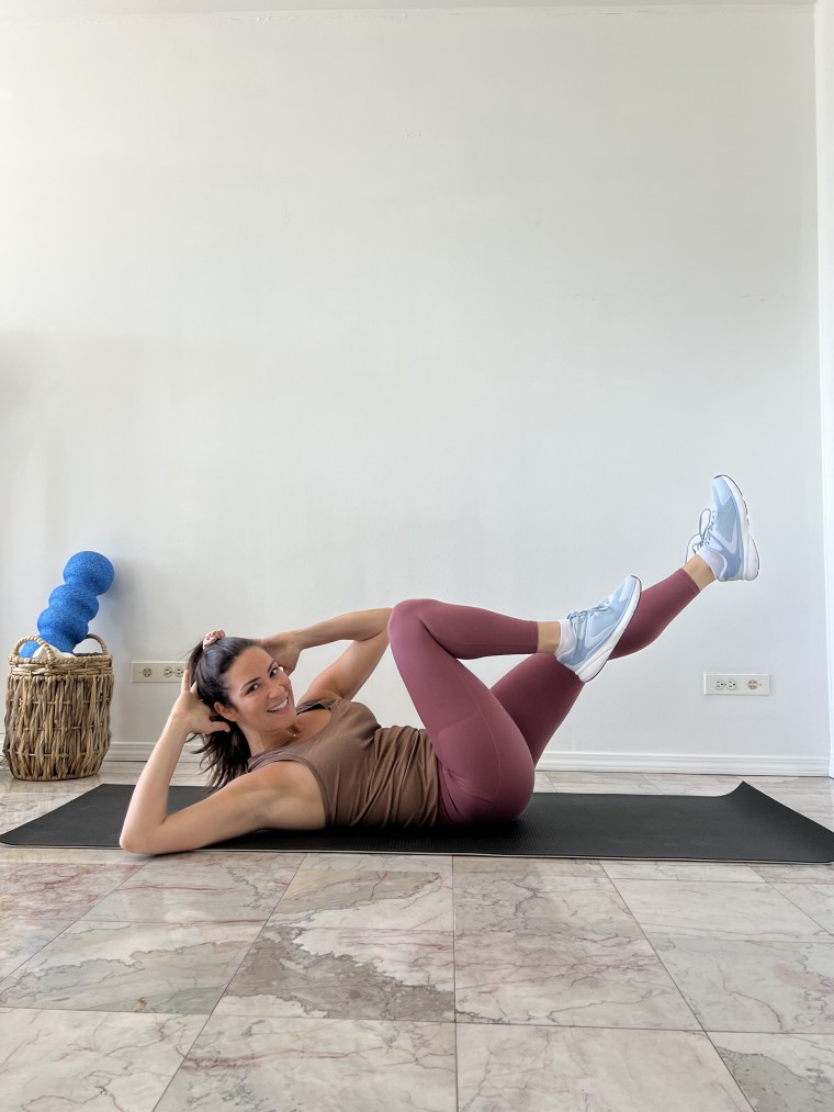 A woman doing a tabata workout 