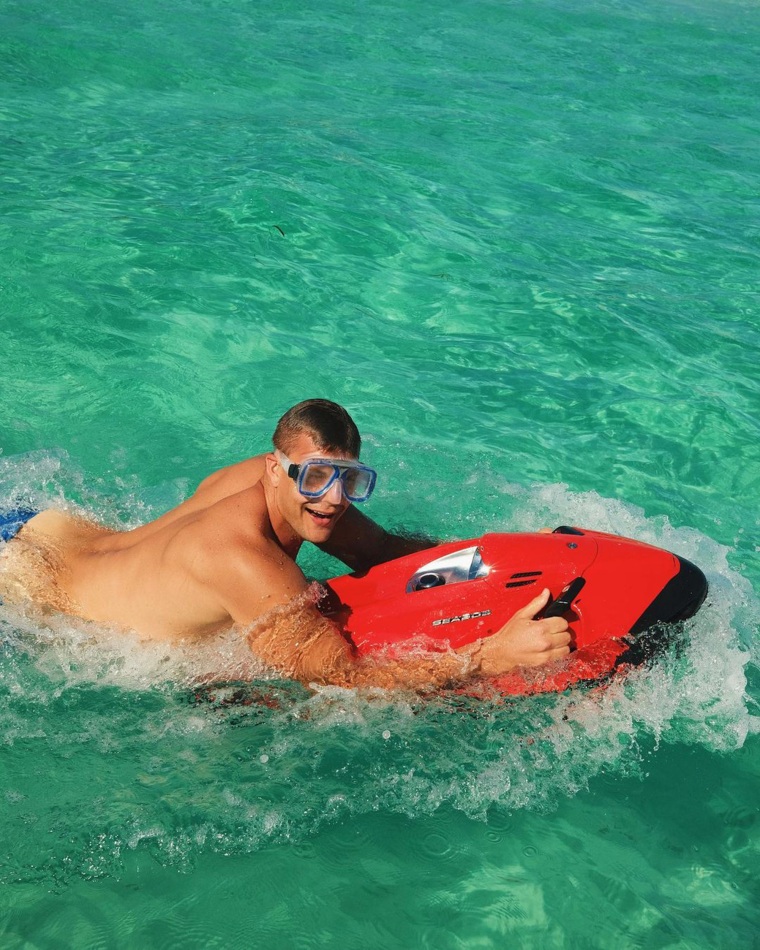 Rob Gronkowski swims in the ocean on vacation.