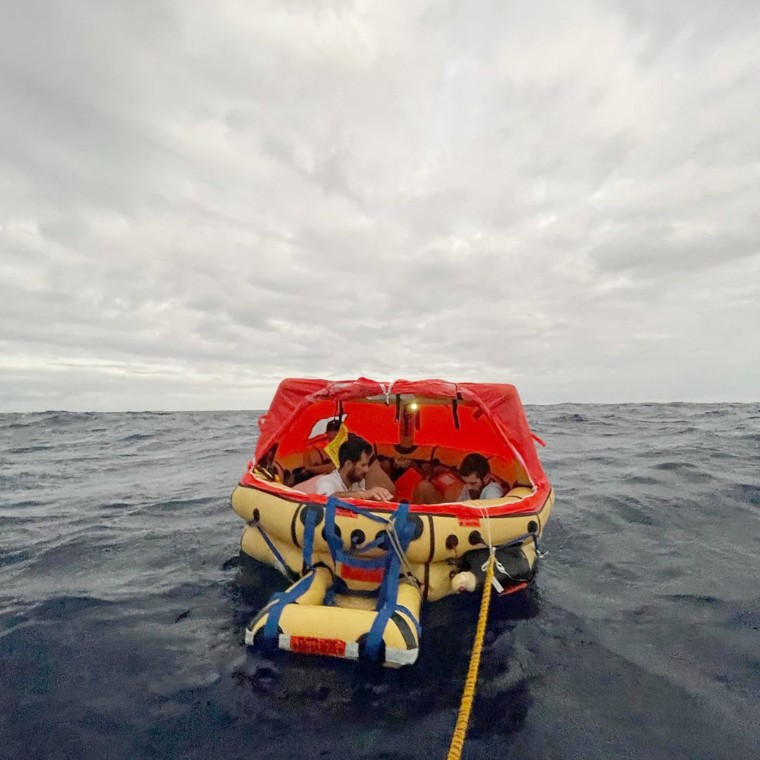 The Raindancer crew in an inflatable life raft.