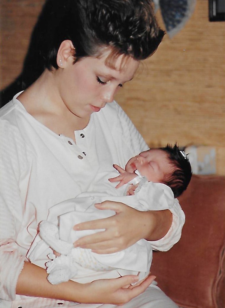 Angie Howard, at age 17, holds her newborn baby Rachel Ruiz before placing her for adoption. The pair would reunite 34 years later.