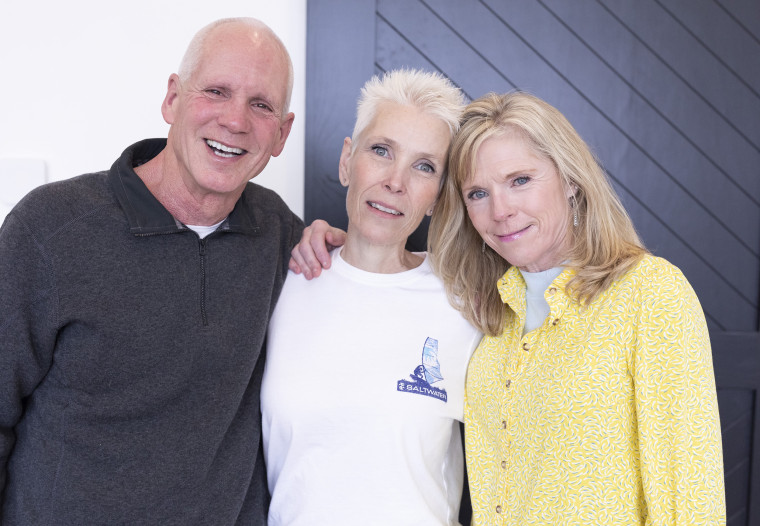 Angie Howard (center) with her daughter Rachel Ruiz's adoptive parents, Brent and Marianne Haslam.