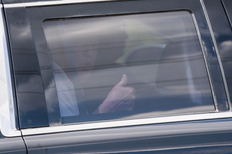 A motorcade carrying former President Donald Trump leaves Trump International Golf Club on April 2, 2023, in West Palm Beach, Fla.